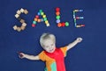 Inscription SALE made from different toys and cute smiling blond