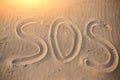 The inscription on the sand beach SOS Royalty Free Stock Photo