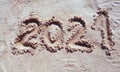 2021 inscription on the sand of the beach. Summer beach holidays in 2021. The message is handwritten Royalty Free Stock Photo