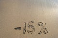 Inscription on the sand minus fifteen percent, 15 % Royalty Free Stock Photo