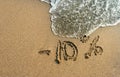 Inscription on the sand minus 10 percent, 10 %, sea wave on the sand with the inscription ten Royalty Free Stock Photo