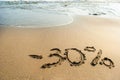 Inscription on the sand minus thirty percent, 30 %, sea wave on the sand with the inscription thirty Royalty Free Stock Photo