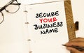 inscription SECURE YOUR BUSINESS NAME on white paper