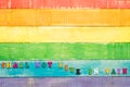 Shall not live in vain, on textured wooden background in lgbt flag color