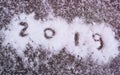 Inscription 2019 on the snow close-up. New Year two thousand and nineteen