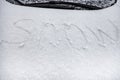 The inscription snow, on the hood of the car