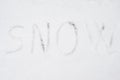 Inscription snow on snow-covered ice