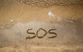 Inscription sos in the sand Royalty Free Stock Photo