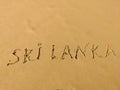 The inscription Sri lanka on the fine yellow beach sand. Hikkaduwa, Sri Lanka Royalty Free Stock Photo