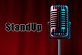 The inscription stand-up, Retro microphone in metallic color on a background of red wings. Concept of stand-up performance, show,