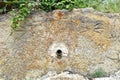 Fountain with its spout in the depopulated village of Buimanco, Soria, Spain.