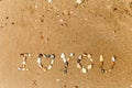 Inscription stones in the sand the word love