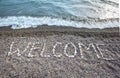 Inscription from stones WELCOME at stony coast