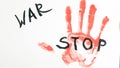 the inscription stop the war on white paper. bloody hand palm print Royalty Free Stock Photo