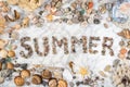 Inscription summer with pebbles, star, stones and shells lying on a marble background, composition of ocean stones and seashells,