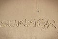 Inscription summer on sand at beach. Vacation time Royalty Free Stock Photo