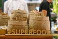 The inscription is super food, with wooden letters on a background of different nuts.