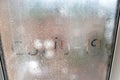 Inscription on sweaty glass with drops - covid-19 Royalty Free Stock Photo