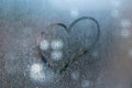 Inscription on sweaty glass with drops - love and heart Royalty Free Stock Photo