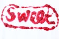 The inscription `Sweet` written topping on a white background.  The inscription `Sweet`, written in strawberry jam. Love concept. Royalty Free Stock Photo