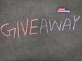 The inscription text on the grey board,GIVE AWAY. Royalty Free Stock Photo