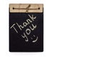 The inscription thank you is written in chalk on a black board on a white background Royalty Free Stock Photo