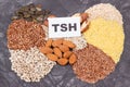 Inscription TSH and thyroid shape made of healthy ingredients. Source natural vitamins