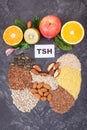 Inscription TSH and thyroid shape made of healthy ingredients. Source natural vitamins Royalty Free Stock Photo