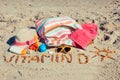 Inscription vitamin D, accessories for relax and childrens playing on sand at beach. Prevention of vitamin D deficiency. Healthy Royalty Free Stock Photo