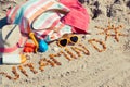 Inscription vitamin D, accessories for relax and childrens playing on sand at beach. Prevention of vitamin D deficiency. Healthy Royalty Free Stock Photo