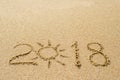Inscription on wet sand 2018. Concept photo of summer vacation Royalty Free Stock Photo