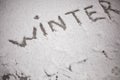 Inscription winter on the snow. Snow texture Royalty Free Stock Photo
