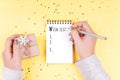 The inscription WISH LIST in a white notebook. A woman writes plans for the next year or birthday Royalty Free Stock Photo