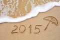 Inscription of the year 2015 written in the wet yellow beach sa Royalty Free Stock Photo