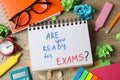 Inscription Are you ready for exams? and different stationary on wooden background Royalty Free Stock Photo