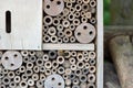 An insect hotel for bees, wasps and other insects made of wood