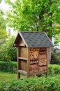 Insect hotel in garden Royalty Free Stock Photo