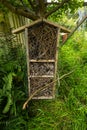 Insect hotel hanging from a tree.. Royalty Free Stock Photo