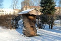 Insect hotel or house in cold winter park in Riga, Latvia. Sign translation from Latvian Royalty Free Stock Photo