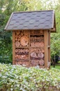 Insect hotel house in garden Royalty Free Stock Photo