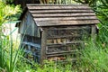 An insect hotel made from wood.