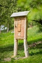 Insect hotel - wooden house made for bugs and solitary insect bees, wasps,...