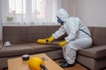 uniform pesticide exterminator kill sofa insect control pest termite cockroach. Generative AI. Royalty Free Stock Photo