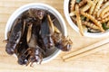 Insects and wooden spoon on the wood table. The concept of protein food sources from insects. Brachytrupes portentosus crickets is