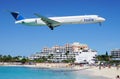 An Insel Air MD80 plane lands over Maho Beach in St Martin