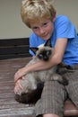 Best friends, schoolboy and his little cat