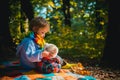 Inseparable with toy. Boy cute child play with teddy bear toy forest background. Child took favorite toy to nature Royalty Free Stock Photo