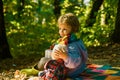 Inseparable with toy. Boy cute child play with teddy bear forest background. Child took favorite toy to nature. Picnic Royalty Free Stock Photo