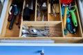 Insert wooden flatware tray drawer organizer with kitchen silverware. Divider utensil storage made of bamboo.