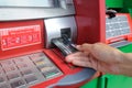 Insert card into an ATM to begin a financial transaction